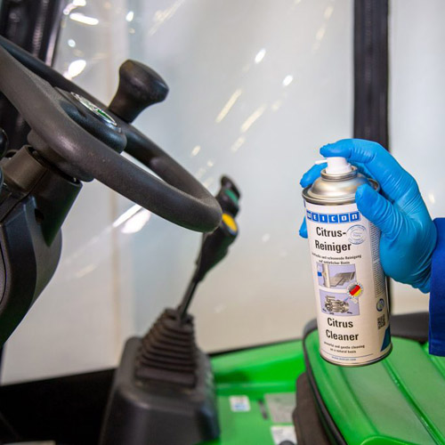 Citrus Cleaner disinfecting a forklift steering wheel